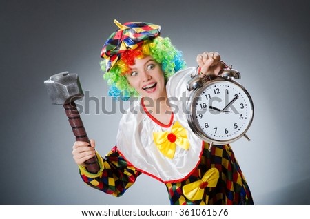 Clown with hammer and clock