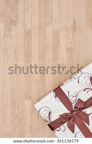 A studio photo of a gift with a bow