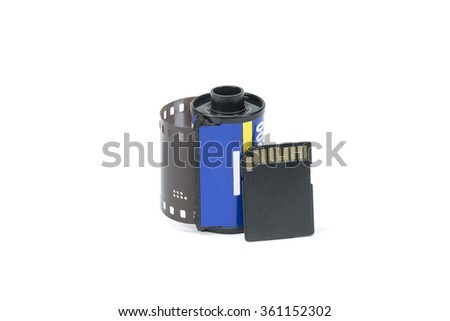 35 mm film roll and SD memory card on isolated white background. 