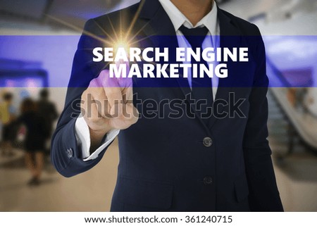 Businessman touching SEARCH ENGINE MARKETING sign on virtual screen ,business concept ,business idea