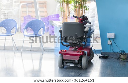 Electric scooter charging up Royalty-Free Stock Photo #361264151