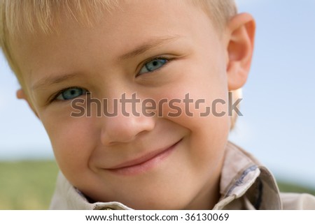 Portrait of the smiling little boy, six years.