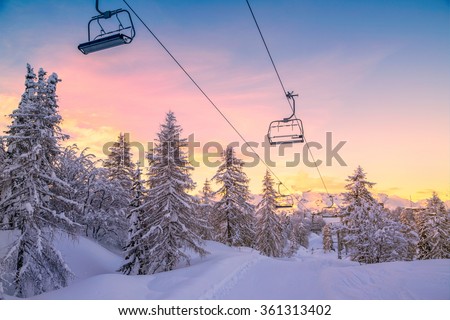 Winter mountains panorama with ski slopes and ski lifts near Vogel ski center, Slovenia Royalty-Free Stock Photo #361313402
