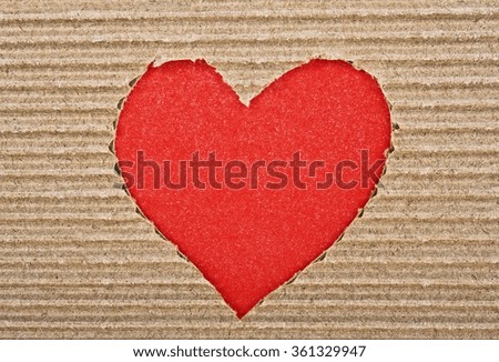 Red heart cut from corrugated cardboard