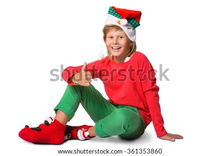 winter holiday christmas concept - boy in santa hat portrait on white isolated