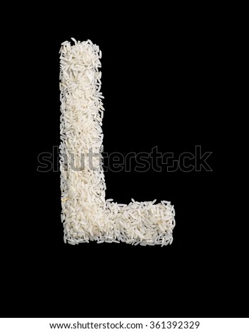 White rice grain alphabet letter isolated on black.