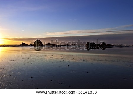 Seastacks on Ruby Beach pictured on low tide during beautiful sunset, Washington, USA