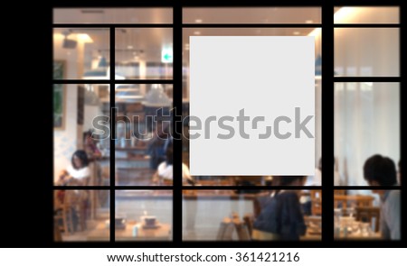 Blank promotion poster on glass window at storefront