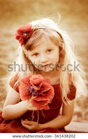 blond girl with long hair and red flowers sepia toned