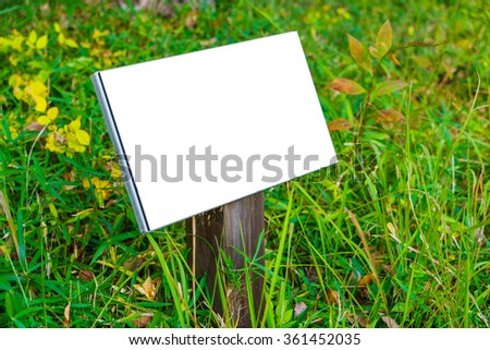 Wood sign on grass