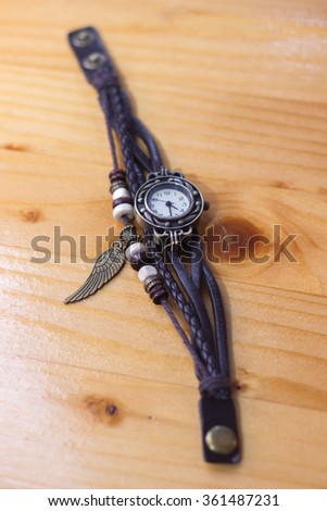 Vintage old watch on the wooden table