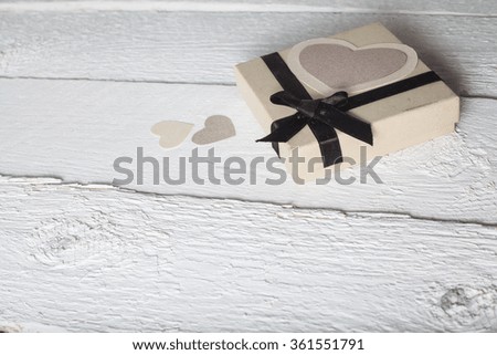 a gift from the heart of paper with love. bright picture on a wooden background