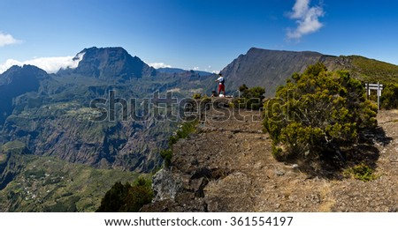Tourists enjoy a beautiful view into the interior of Reunion Island in the Cirque de Mafate