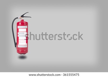 Fire extinguisher on a grey background