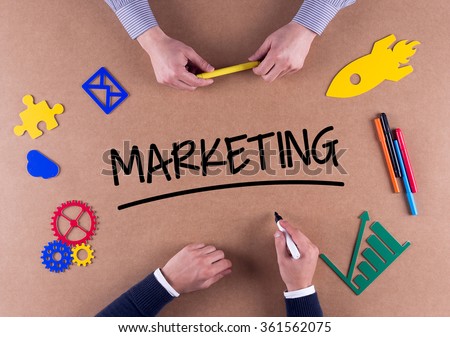 Business Team with a single word MARKETING