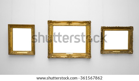 Three gold empty frame on white wall