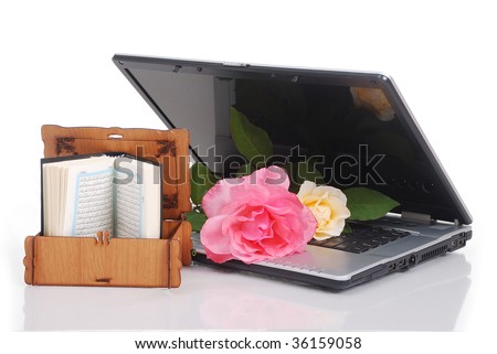 Beautiful roses and laptop, put together isolated