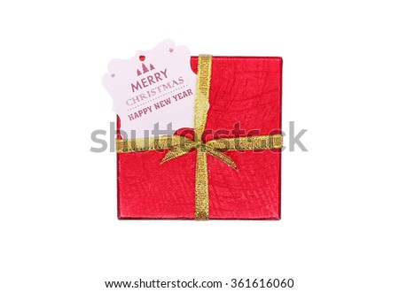 Wrapped vintage gift box and red ribbon bow with merry christmas and happy new year card, isolated on white

