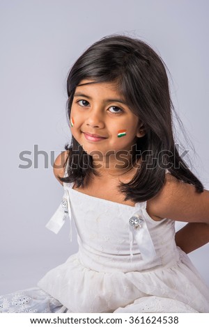 closeup picture of Cute little girl with Indian Tricolour painted on face