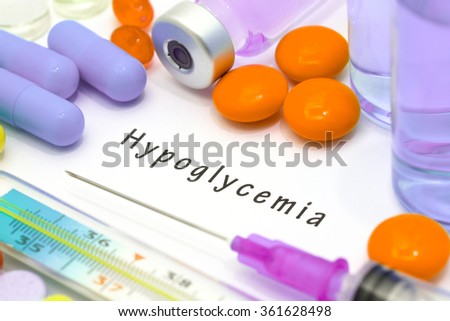 Hypoglycemia - diagnosis written on a white piece of paper. Syringe and vaccine with drugs Royalty-Free Stock Photo #361628498