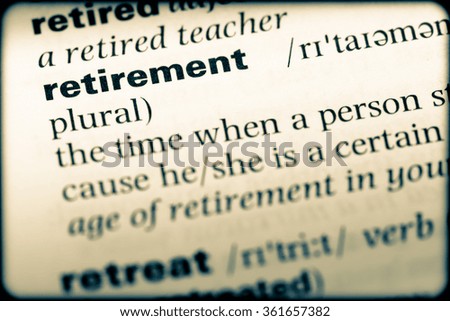 Close up of English dictionary page with word retirement
