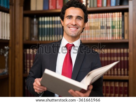 Portrait of a businessman reading a book