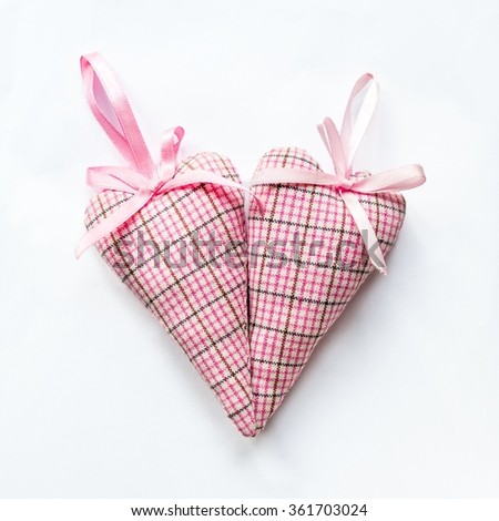 two handmade textile heart with bow