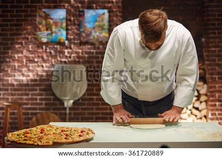 Chef is cooking the best pizza in the world