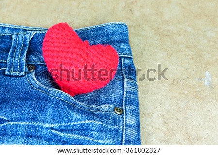 Crochet heart red color on blue Jeans