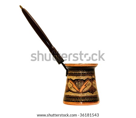 Photo of turkish coffee pot isolated over white background
