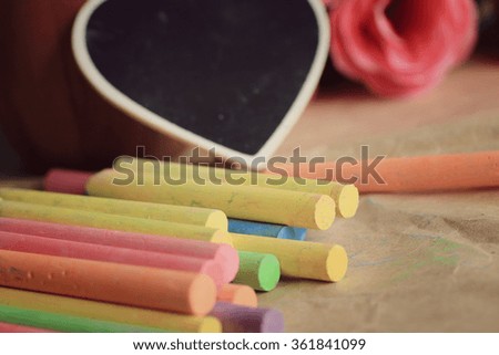 Colorful chalk with black heart