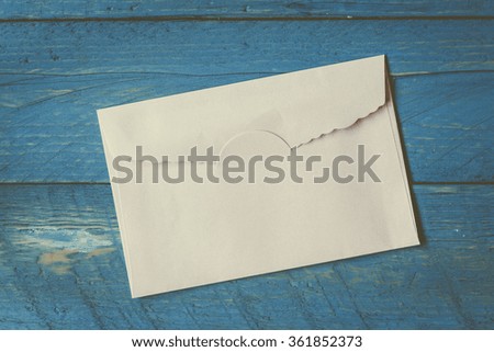 A envelope on wooden background