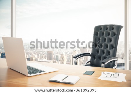 Workplace of the head with a laptop and a classic leather armchair Royalty-Free Stock Photo #361892393