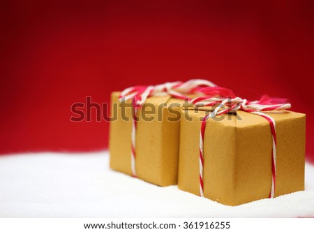 gift box on snow red background