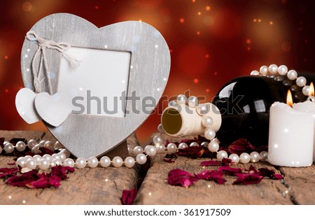 St Valentine's setting with red heart, candles, pearl, present and red wine, Valentine day concept