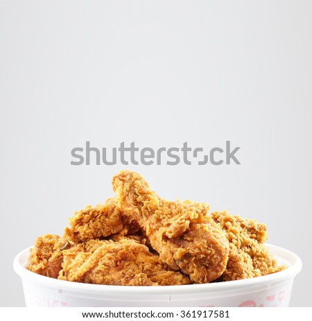 crispy kentucky fried chicken bucket in a white background  Royalty-Free Stock Photo #361917581