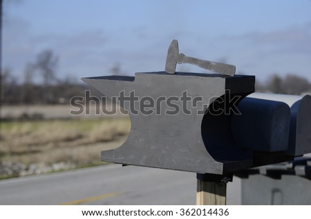 Handmade Black Metal Mailbox By Road in Country with Hammer Flag
