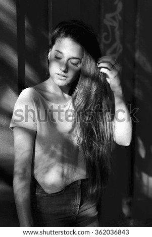 portrait of a young beautiful woman in abandoned place