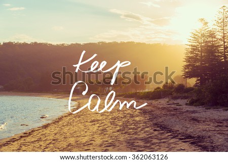 Handwritten text over sunset calm sunny beach background, KEEP CALM, vintage filter applied, motivational concept image