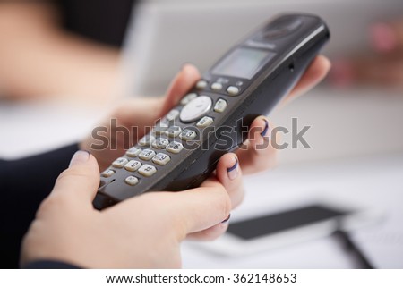 Radio phone in female hands