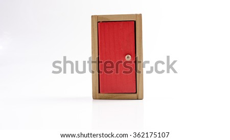 Wooden red door being closed or open from inside. Isolated on white background. Slightly de-focused and close-up shot. Copy space.