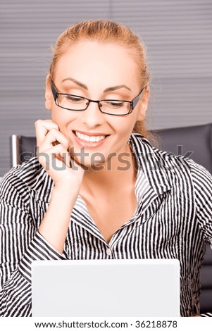 picture of lovely girl with computer in office