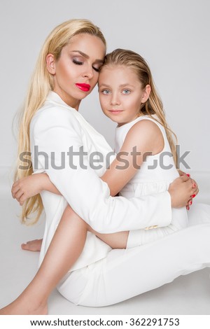Happy mother's day! child daughter and mother embraced, cuddling - Image. Mother and daughter concept.