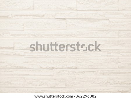 Surface brown wall of stone wall sepia tones for use as background. The new design of modern white stone wall. Pattern of decorative gray stone wall surface.