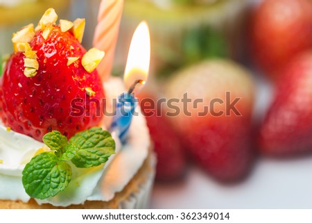 Homemade strawberry cupcakes. Decorate with cream, fresh strawberry and mint. It looks yummy. You can apply for website decor, birthday card,background,wallpaper and artwork design.