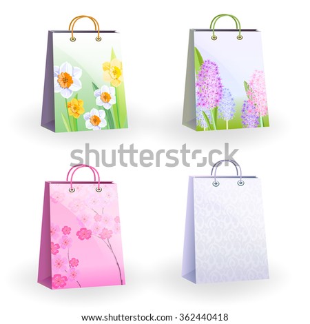 Set of four shopping bags different colors. On three bags are drawn spring flowers.
