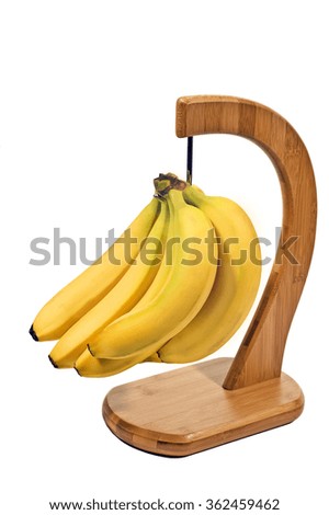 Bananas and banana holder isolated on white./ Delicious hanging bananas