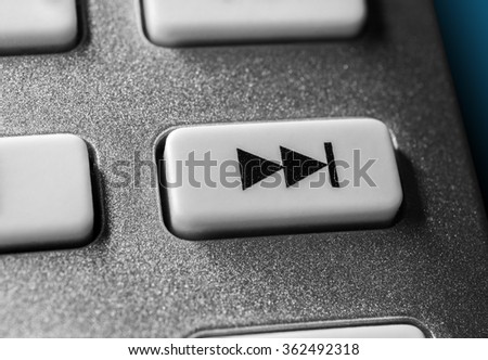 Macro Of A Grey Skip Forward Button On Chrome Remote Control For A Hifi Stereo Audio System