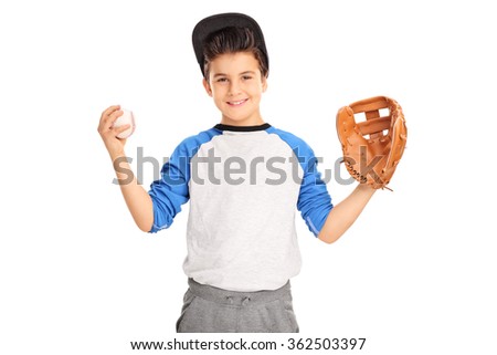 Little kid with baseball glove holding a baseball and looking at the camera isolated on white background