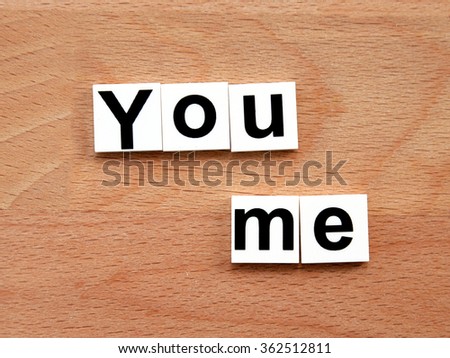 You and me, word concept on wooden background